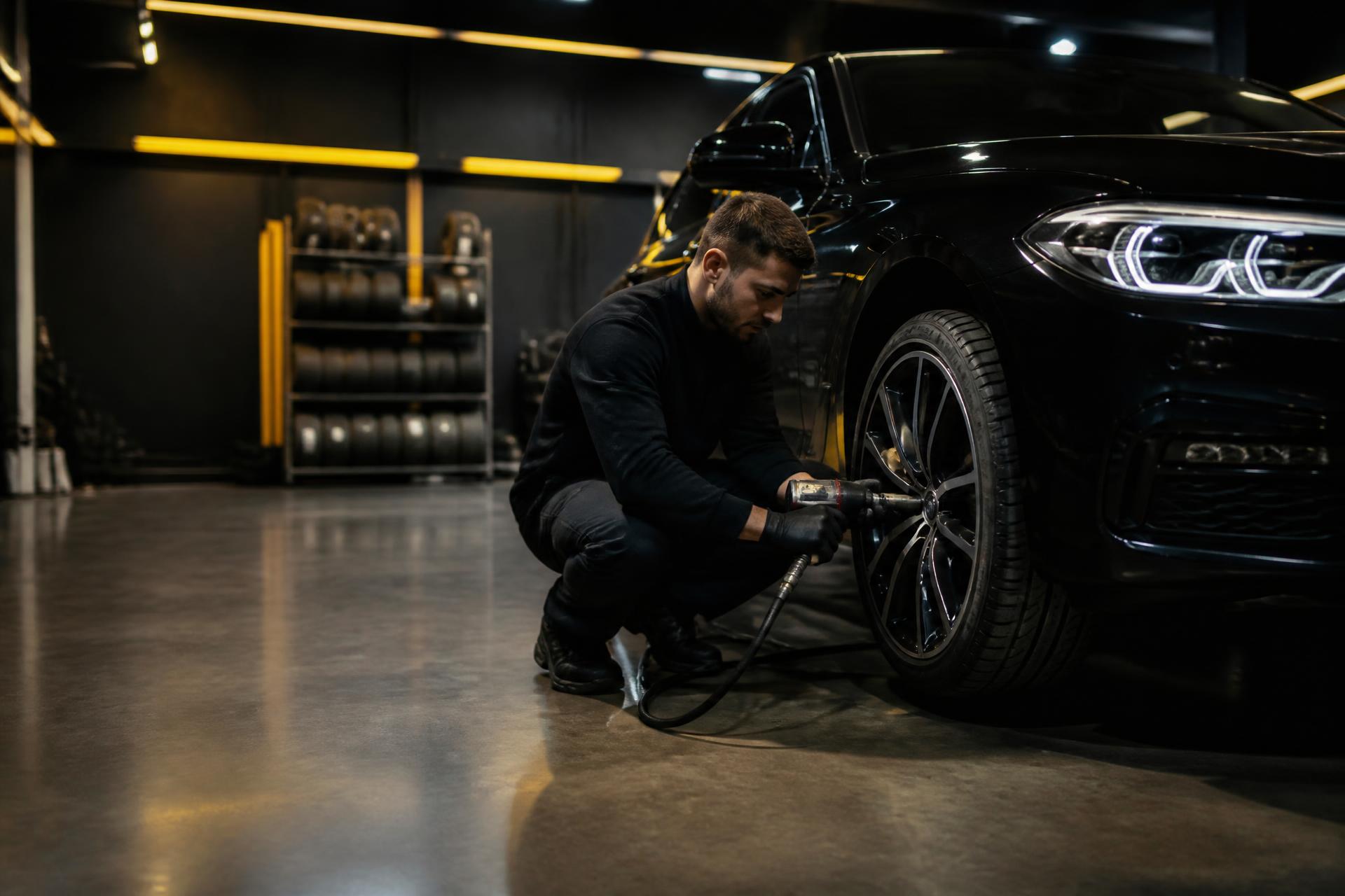 Sam Tyres mechanic fitting a new tyre in the Tottenham workshop